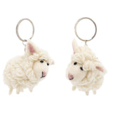Two off-white wool felt sheep keychains are displayed against a bright white backdrop. Each mini sheep keychain is crafted from textured 100% wool felt, resembling a fluffy coat, with small black eyes and pink felt in their ears. They each feature a metal ring with a clasp for easy attachment.