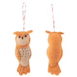 A handcrafted wool felt owl ornament is displayed against a stark white background, showcasing both its front and back views. This charming felt owl ornament features a blend of orange and beige hues, with small round eyes and tufted ear details. Visible stitch details across its body add to its rustic charm, and a red and white cotton string is attached for hanging.