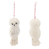 A cream-colored wool felt owl ornament is displayed against a stark white background, shown in two views. It features a rounded head with a small beak and a body detailed with simple black stitch marks suggesting feathers. A cotton string is attached at the top for easy hanging.