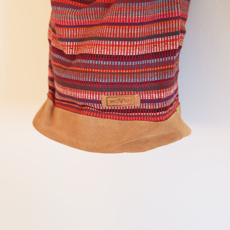 Red Woven sling bag with a zipper. Handmade in Nepal.
